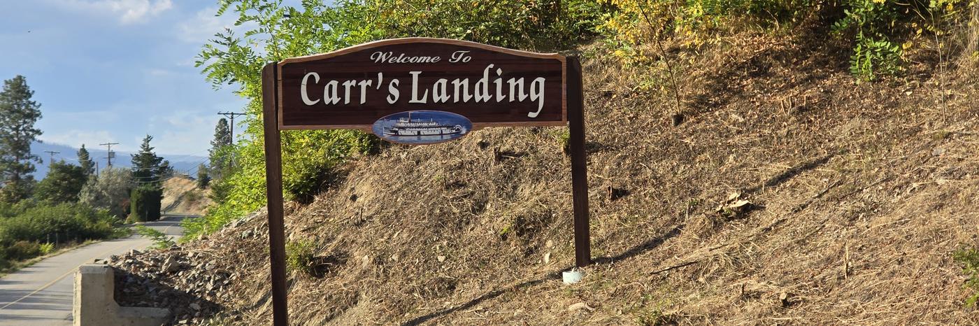The Welcome to Carr's Landing sign beside Carr's Landing Road